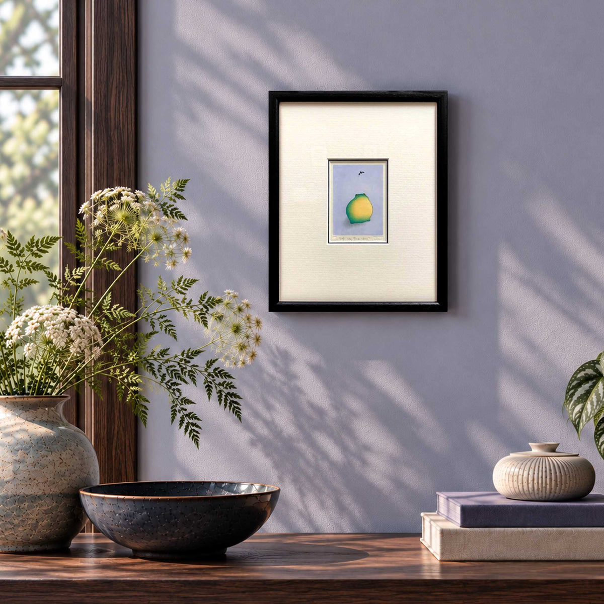 Frog and fruit fly - original handmade Japanese woodblock print framed in black on lilac wall  in room set. Frame is 8" x 10"