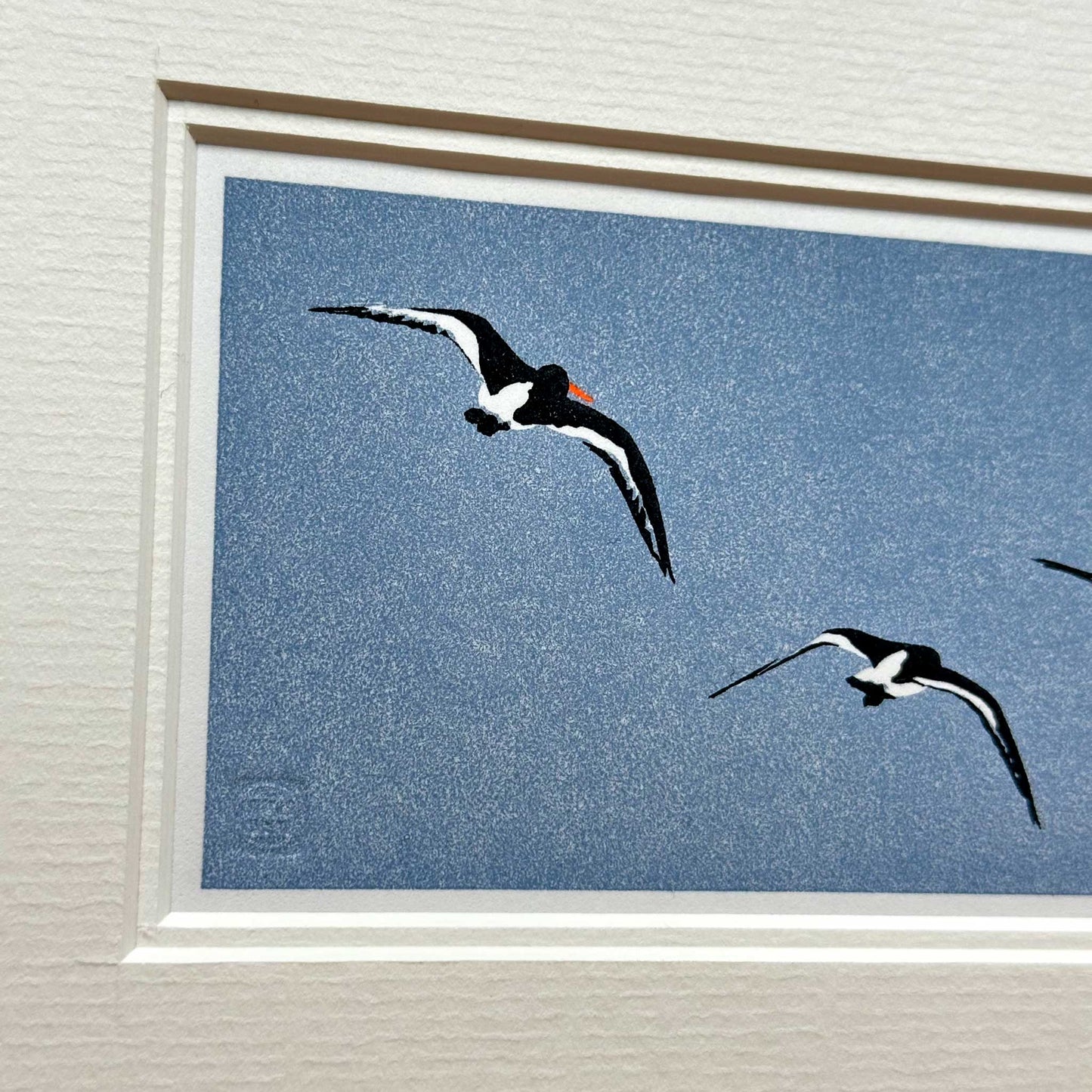 Handmade print of Oyster Catchers in Flight against blue background - detail view 1
