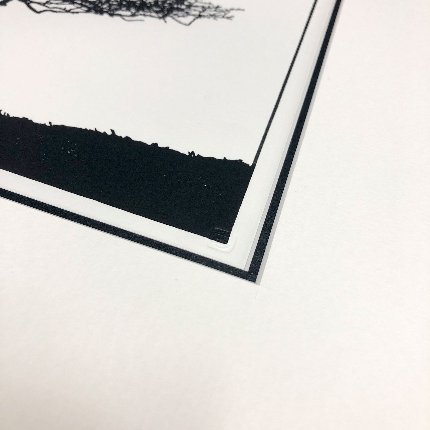 Embossed chop seal detail on original woodblock print.